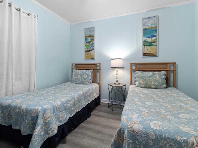 5000 N Ocean Blvd Unit B-1, North Myrtle Beach, SC 29582 - bedroom featuring crown molding, baseboards, and wood finished floors