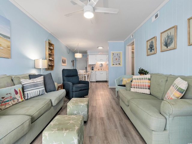 5000 N Ocean Blvd Unit B-1, North Myrtle Beach, SC 29582 - living room featuring crown molding, visible vents, light wood-style floors, baseboards, and ceiling fan