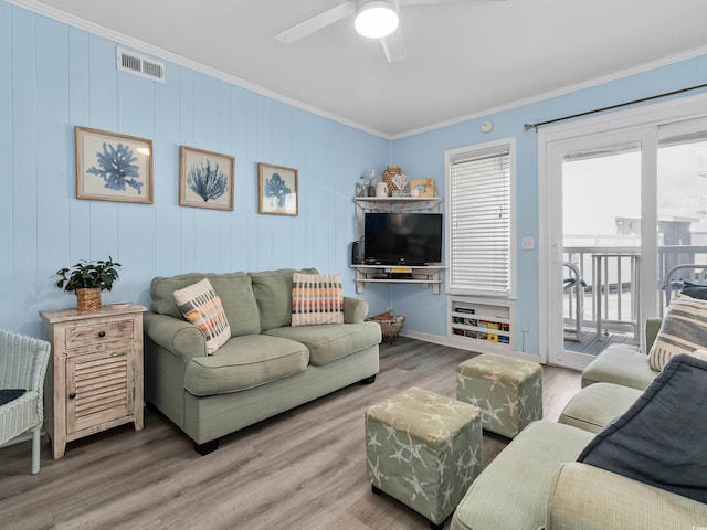 5000 N Ocean Blvd Unit B-1, North Myrtle Beach, SC 29582 - living room with crown molding, ceiling fan, wood finished floors, and visible vents