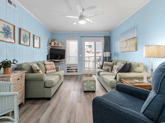 5000 N Ocean Blvd Unit B-1, North Myrtle Beach, SC 29582 - living area with crown molding, a ceiling fan, visible vents, and wood finished floors