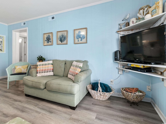 5000 N Ocean Blvd Unit B-1, North Myrtle Beach, SC 29582 - living area with crown molding, visible vents, and wood finished floors