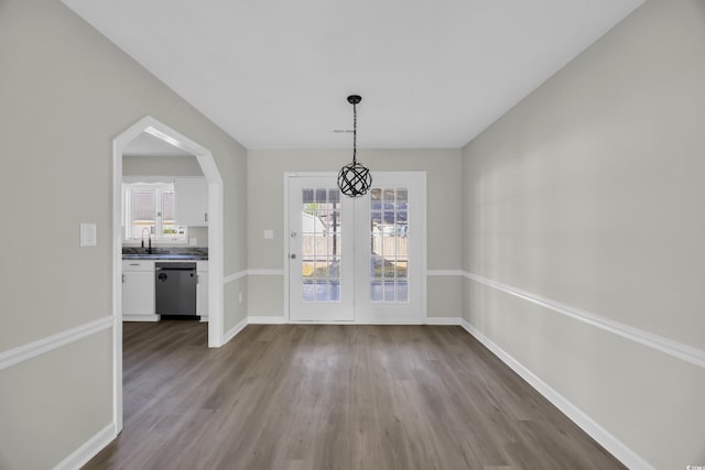 202 Berkshire Dr, Myrtle Beach, SC 29588 - unfurnished dining area with baseboards, a healthy amount of sunlight, and dark wood-style floors