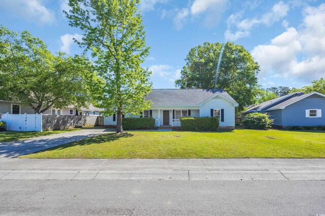 202 Berkshire Dr, Myrtle Beach, SC 29588 - ranch-style home featuring driveway, fence, a porch, and a front yard