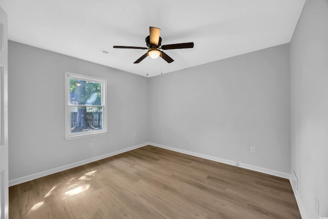 202 Berkshire Dr, Myrtle Beach, SC 29588 - empty room featuring wood finished floors, visible vents, a ceiling fan, and baseboards