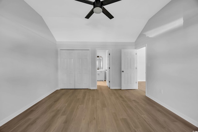 202 Berkshire Dr, Myrtle Beach, SC 29588 - unfurnished bedroom with lofted ceiling, wood finished floors, and baseboards