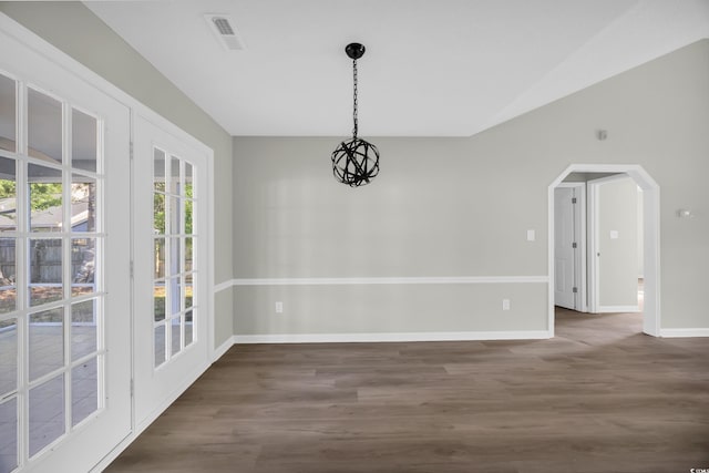 202 Berkshire Dr, Myrtle Beach, SC 29588 - unfurnished dining area featuring arched walkways, baseboards, wood finished floors, and visible vents