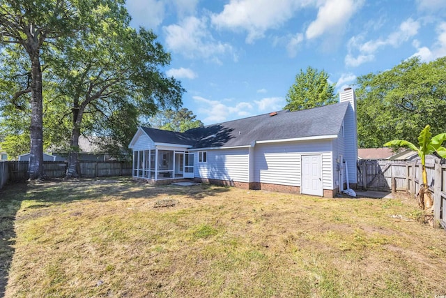 202 Berkshire Dr, Myrtle Beach, SC 29588 - rear view of house featuring a fenced backyard, a sunroom, a shingled roof, and a lawn