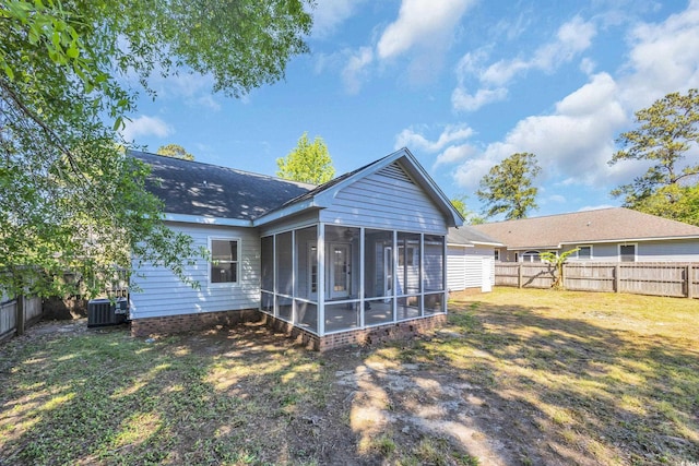 202 Berkshire Dr, Myrtle Beach, SC 29588 - rear view of property featuring cooling unit, a yard, a sunroom, and a fenced backyard
