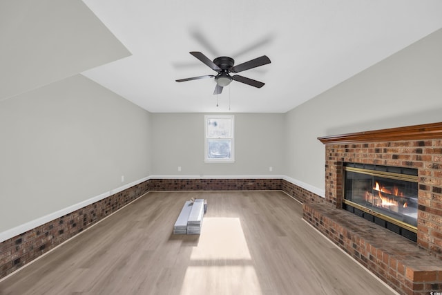 202 Berkshire Dr, Myrtle Beach, SC 29588 - unfurnished living room featuring wood finished floors, a brick fireplace, and ceiling fan