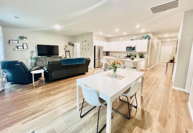 147 Marsh Deer Pl, Surfside Beach, SC 29575 - dining area with light wood-style floors, recessed lighting, and baseboards
