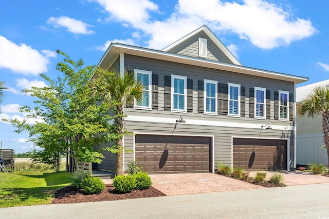 19 Red Skiff Ln Unit 15, Pawleys Island, SC 29585 - view of front of home with decorative driveway and a garage