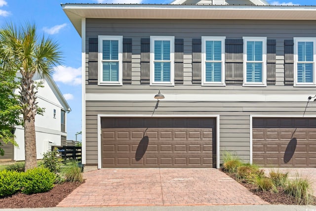 19 Red Skiff Ln Unit 15, Pawleys Island, SC 29585 - garage featuring decorative driveway
