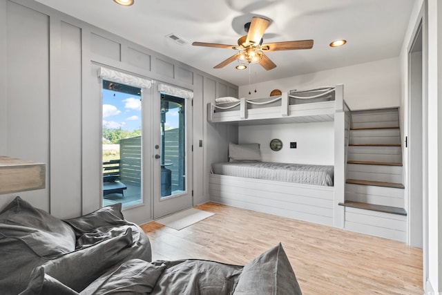 19 Red Skiff Ln Unit 15, Pawleys Island, SC 29585 - bedroom featuring french doors, access to exterior, wood finished floors, recessed lighting, and a ceiling fan