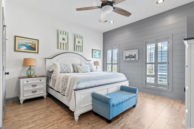 19 Red Skiff Ln Unit 15, Pawleys Island, SC 29585 - bedroom with recessed lighting, light wood-type flooring, wood walls, and a ceiling fan