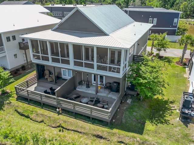 19 Red Skiff Ln Unit 15, Pawleys Island, SC 29585 - rear view of house with french doors, a sunroom, a metal roof, and a deck