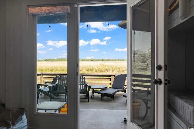 19 Red Skiff Ln Unit 15, Pawleys Island, SC 29585 - doorway to outside with a view of countryside and wood finished floors