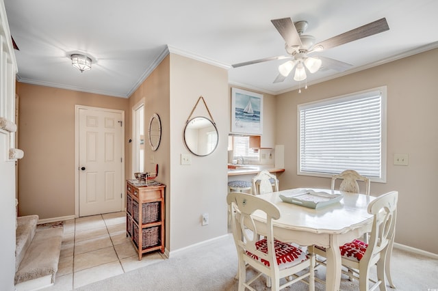 4504 S Ocean Blvd Unit A, North Myrtle Beach, SC 29582 - dining area with baseboards, ornamental molding, a ceiling fan, and light tile patterned floors