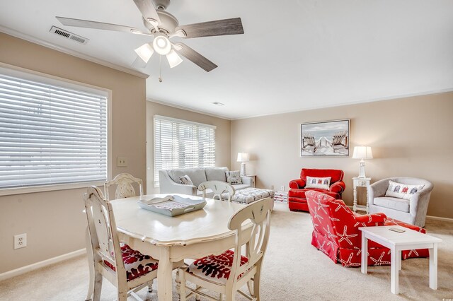 4504 S Ocean Blvd Unit A, North Myrtle Beach, SC 29582 - dining room with carpet floors, ornamental molding, visible vents, baseboards, and ceiling fan