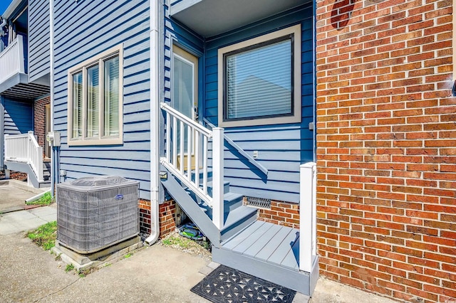 4504 S Ocean Blvd Unit A, North Myrtle Beach, SC 29582 - doorway to property featuring brick siding and central AC unit