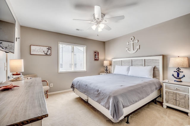 4504 S Ocean Blvd Unit A, North Myrtle Beach, SC 29582 - bedroom with baseboards, visible vents, a ceiling fan, and light colored carpet