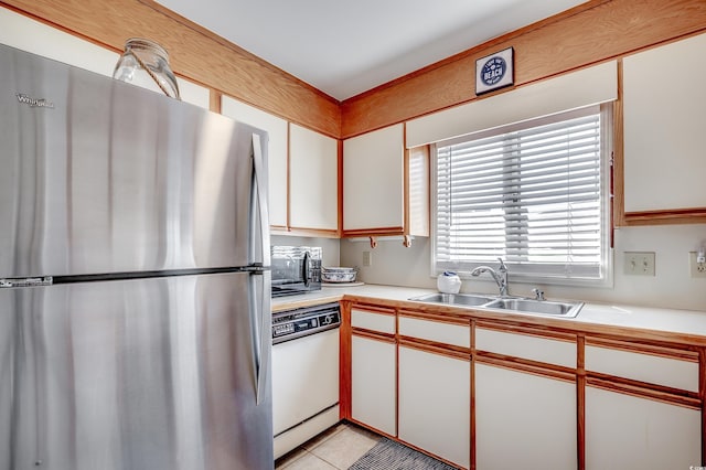 4504 S Ocean Blvd Unit A, North Myrtle Beach, SC 29582 - kitchen featuring a sink, light countertops, freestanding refrigerator, and dishwasher