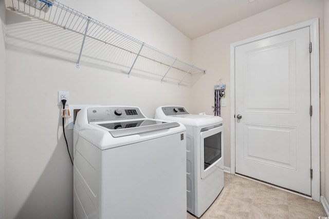 351 Logan St, Little River, SC 29566 - laundry room featuring washer and clothes dryer and baseboards
