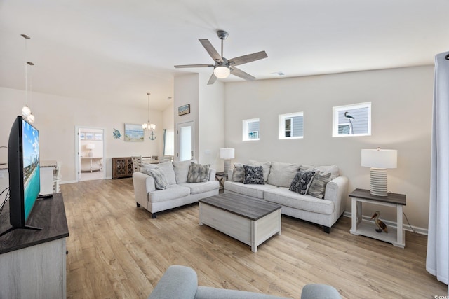 351 Logan St, Little River, SC 29566 - living area featuring light wood finished floors, baseboards, a chandelier, ceiling fan, and high vaulted ceiling