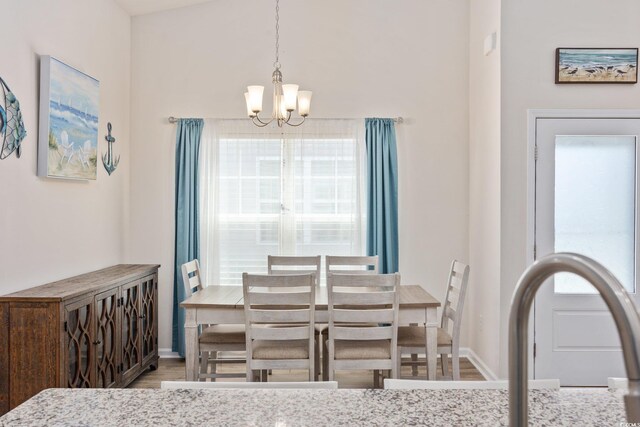 351 Logan St, Little River, SC 29566 - dining area featuring a chandelier, wood finished floors, and baseboards