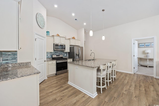 351 Logan St, Little River, SC 29566 - kitchen featuring stainless steel appliances, a sink, backsplash, light wood finished floors, and recessed lighting