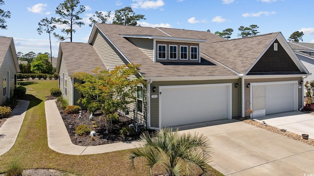 351 Logan St, Little River, SC 29566 - view of front of property with concrete driveway, roof with shingles, a front lawn, and a garage