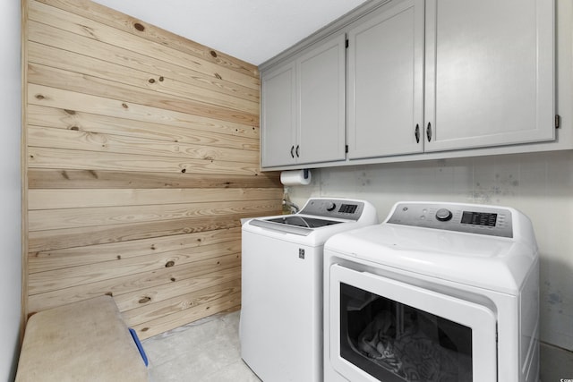 1869 Meadowood Ln, Longs, SC 29568 - clothes washing area with cabinet space, wooden walls, and independent washer and dryer