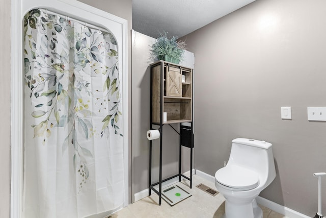 1869 Meadowood Ln, Longs, SC 29568 - bathroom featuring toilet, a shower with shower curtain, visible vents, and baseboards
