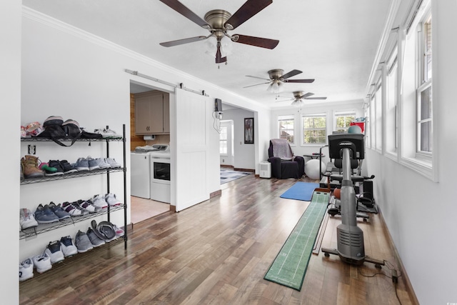1869 Meadowood Ln, Longs, SC 29568 - exercise area with a barn door, wood finished floors, separate washer and dryer, ceiling fan, and ornamental molding