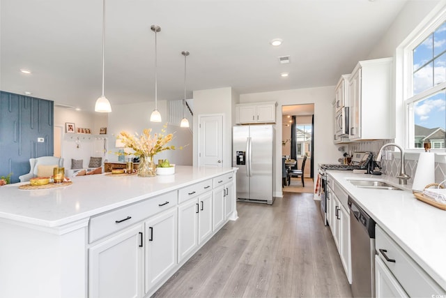 1841 Hardwood Ct, Conway, SC 29526 - kitchen with appliances with stainless steel finishes, a sink, white cabinetry, light countertops, and recessed lighting