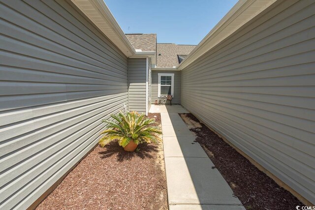 2005 Willow Run Dr Unit C, Little River, SC 29566 - view of property exterior featuring roof with shingles