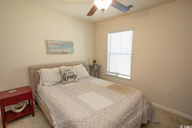 2005 Willow Run Dr Unit C, Little River, SC 29566 - carpeted bedroom featuring ceiling fan, baseboards, multiple windows, and visible vents