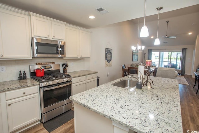 2005 Willow Run Dr Unit C, Little River, SC 29566 - kitchen with a sink, open floor plan, visible vents, wood finished floors, and appliances with stainless steel finishes