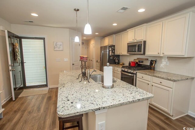 2005 Willow Run Dr Unit C, Little River, SC 29566 - kitchen with dark wood-style floors, stainless steel appliances, visible vents, and a sink