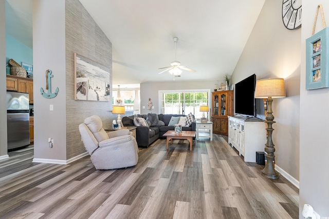 7011 Blade Beak Ln, Myrtle Beach, SC 29588 - living area featuring high vaulted ceiling, ceiling fan, baseboards, and wood finished floors