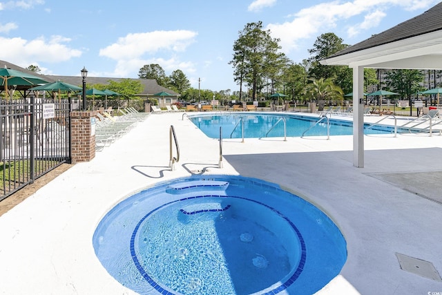 7011 Blade Beak Ln, Myrtle Beach, SC 29588 - pool featuring fence, a hot tub, and a patio