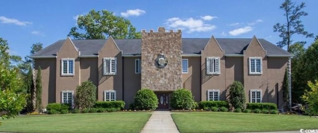 982 Cherrystone Loop, Conway, SC 29526 - view of front of property with stucco siding, a front lawn, and a chimney