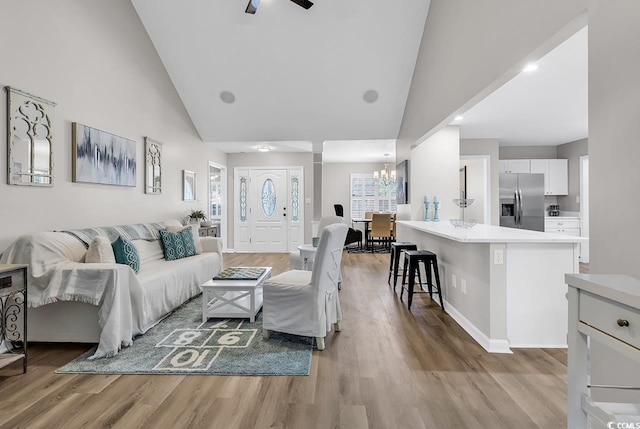 130 Ashton Cir, Myrtle Beach, SC 29588 - living area with recessed lighting, light wood finished floors, baseboards, high vaulted ceiling, and ceiling fan with notable chandelier