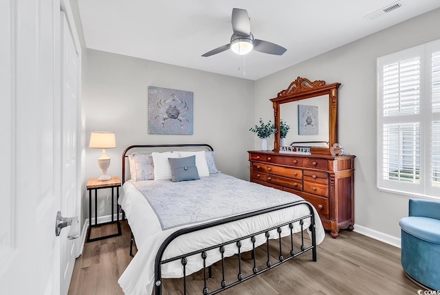 130 Ashton Cir, Myrtle Beach, SC 29588 - bedroom with baseboards, wood finished floors, visible vents, and multiple windows