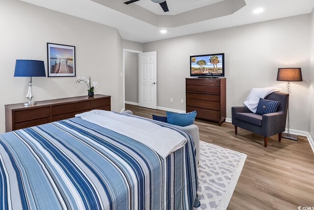 130 Ashton Cir, Myrtle Beach, SC 29588 - bedroom with recessed lighting, a raised ceiling, a ceiling fan, baseboards, and light wood-style flooring