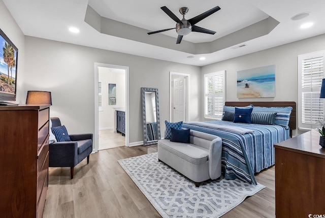 130 Ashton Cir, Myrtle Beach, SC 29588 - bedroom with light wood finished floors, baseboards, a tray ceiling, and visible vents