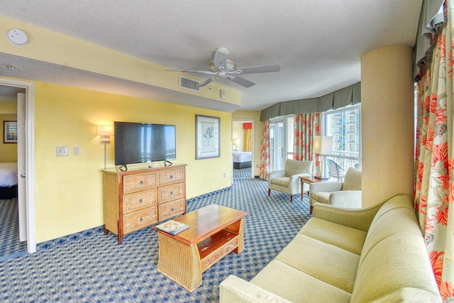 5300 N Ocean Blvd Unit 923, Myrtle Beach, SC 29577 - carpeted living room with visible vents, ceiling fan, and a textured ceiling
