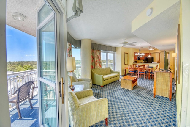 5300 N Ocean Blvd Unit 923, Myrtle Beach, SC 29577 - carpeted living area with a textured ceiling and ceiling fan
