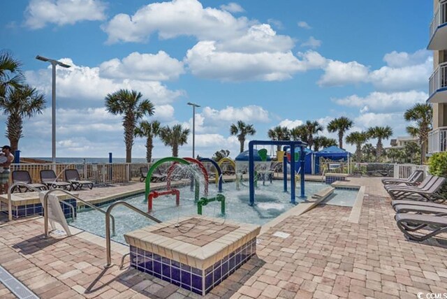 5300 N Ocean Blvd Unit 923, Myrtle Beach, SC 29577 - view of pool with playground community and a patio