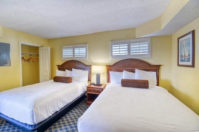 5300 N Ocean Blvd Unit 923, Myrtle Beach, SC 29577 - bedroom featuring a textured ceiling and electric panel
