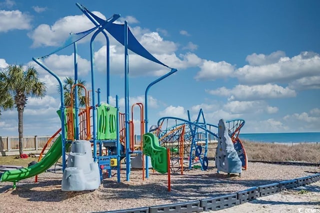 community jungle gym featuring a water view and fence